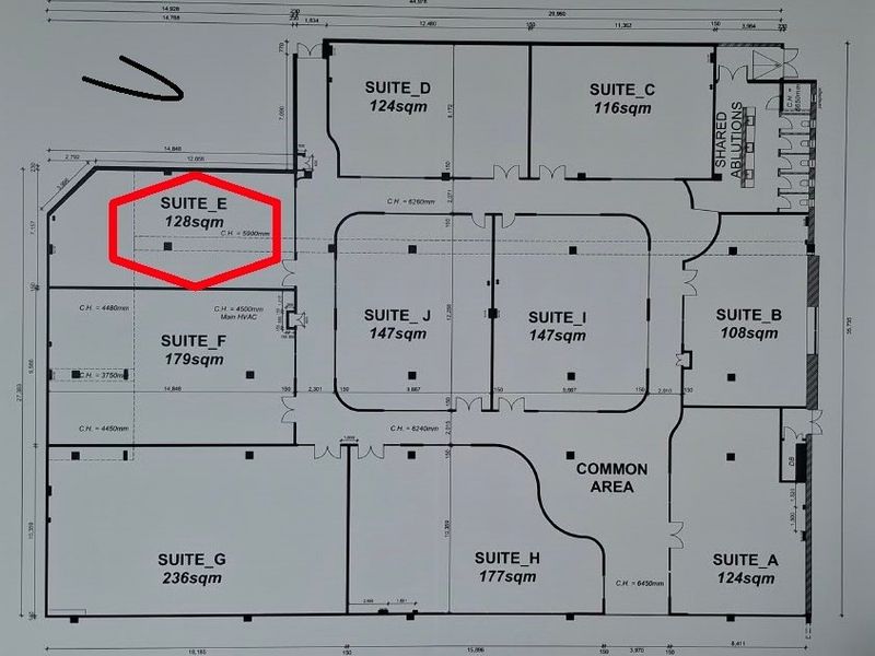 Architectural floor plan showing the layout of office suites and common areas within the commercial property.