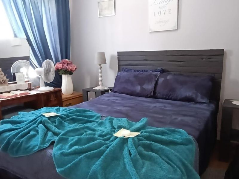 A standard bedroom featuring neutral wall finishes and space for a double bed.