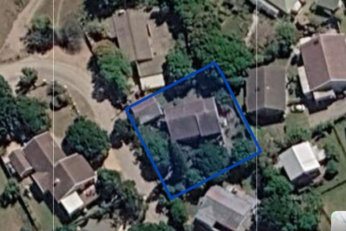 An aerial satellite view showing the property layout, roof structure, and surrounding residential neighborhood context.