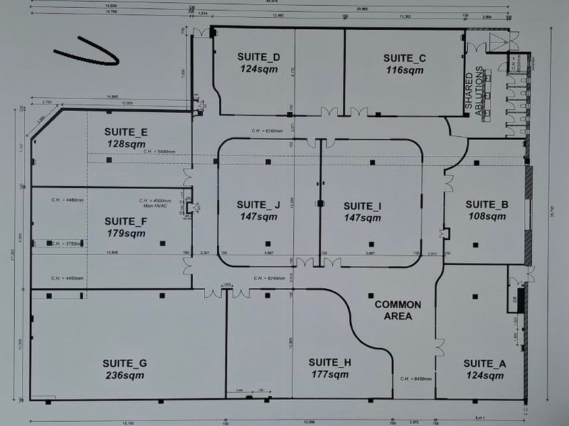 Architectural floor plan showing the layout of office suites and shared ablutions within the commercial property.