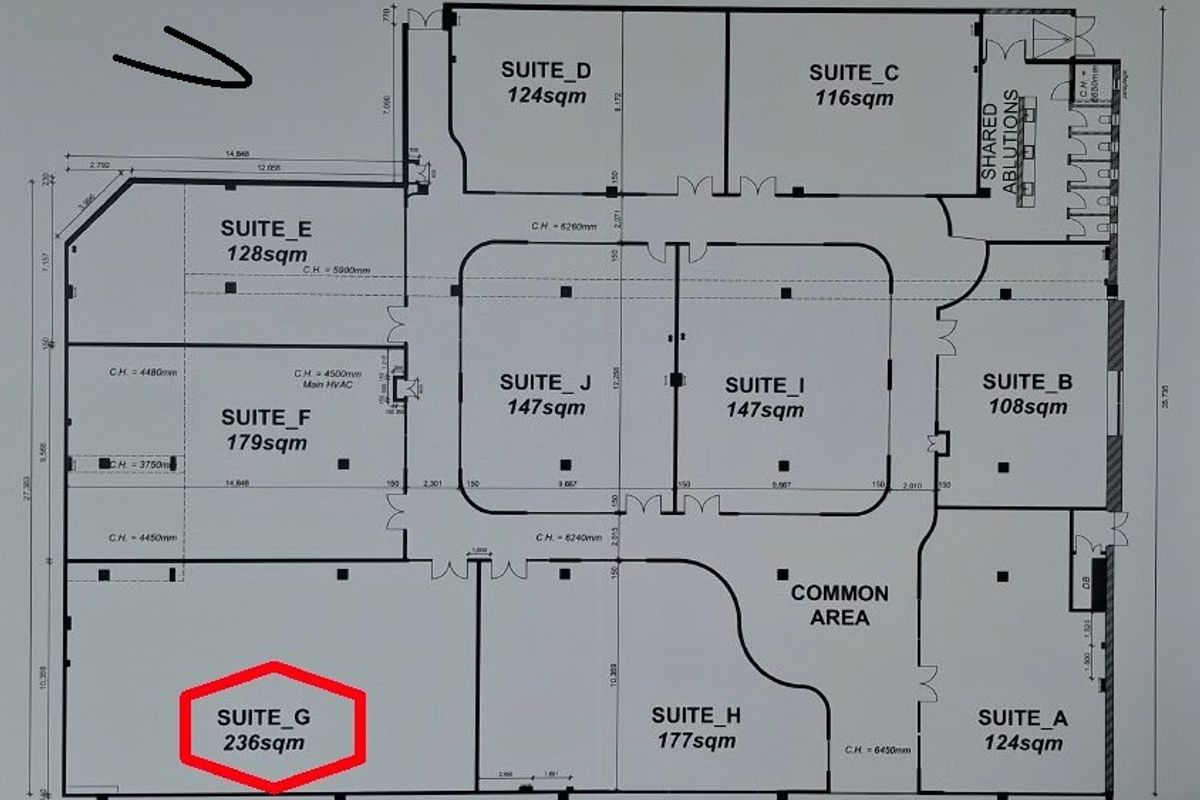 A detailed architectural floor plan showing the layout of multiple office suites and a common area within the commercial property.