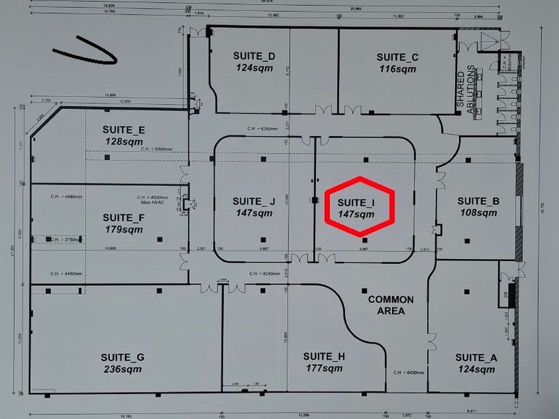 Architectural floor plan of an office building layout, highlighting Suite I with a total area of 147 square meters.