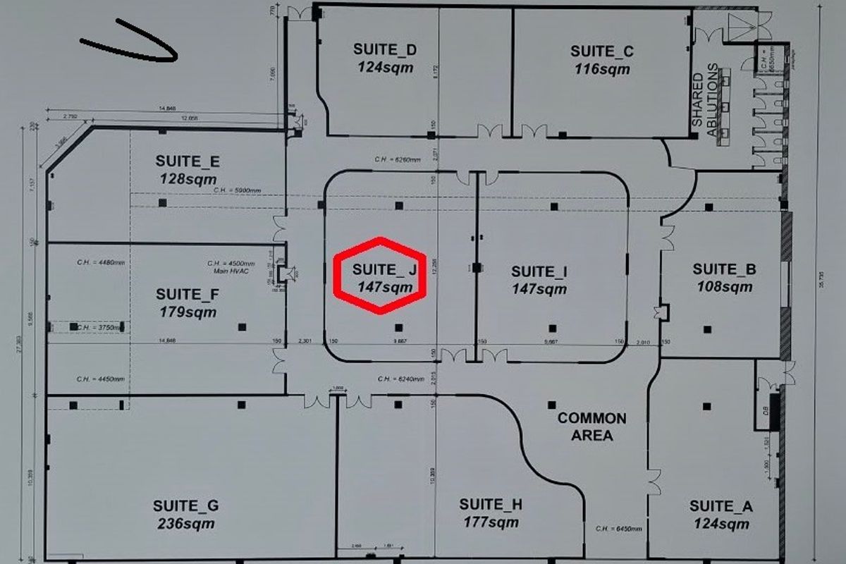 Architectural floor plan showing the layout of multiple office suites, shared ablutions, and a common area within the commercial property.
