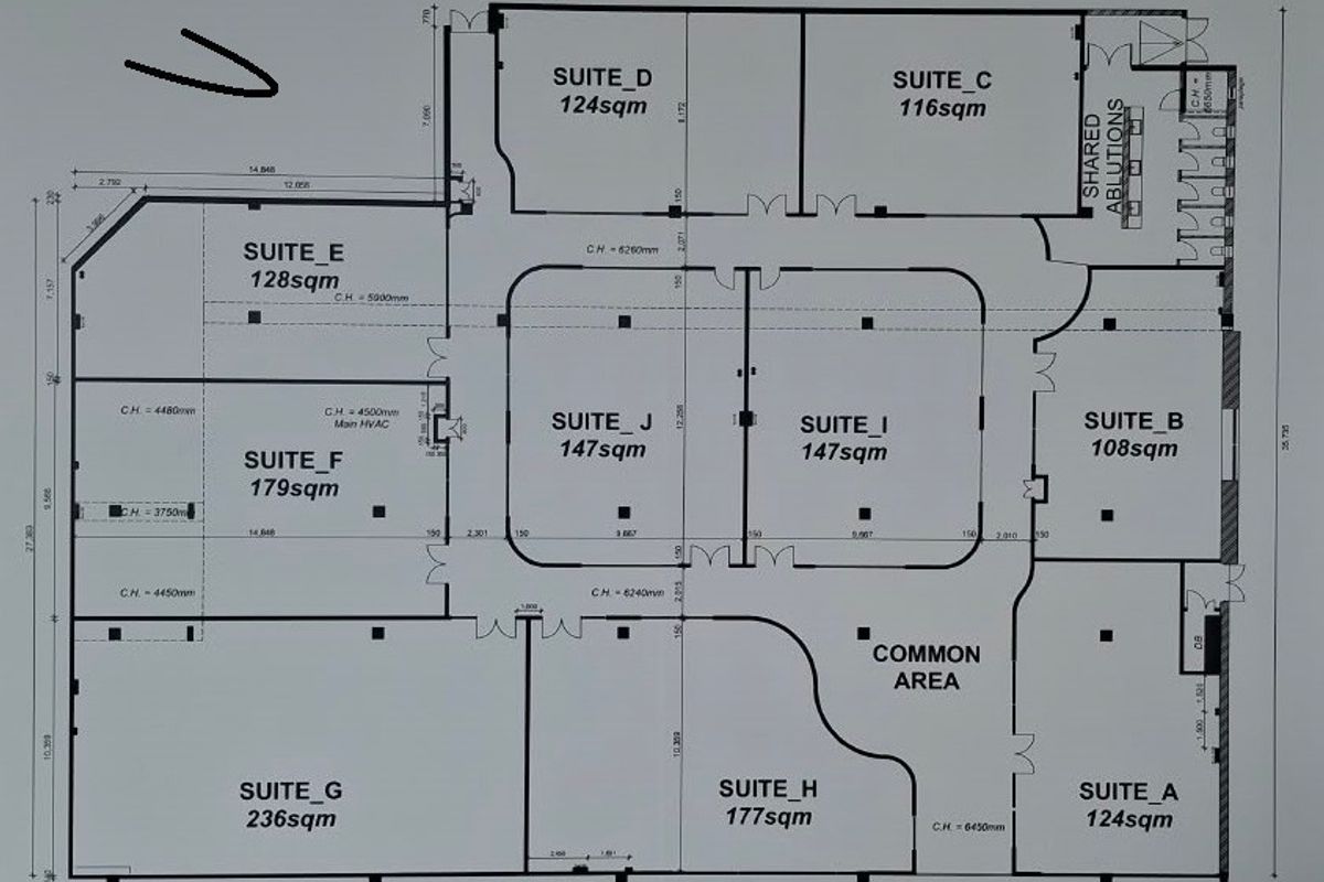 Architectural floor plan showing the layout of office suites and shared ablutions within the commercial property.