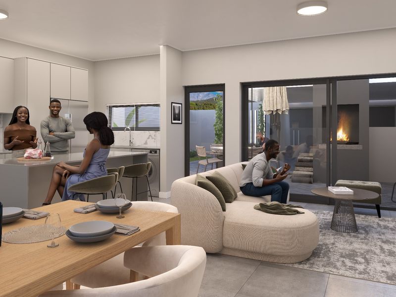 Modern open-plan living area featuring a sleek kitchen with island, seamless flow to an outdoor patio with fireplace, and contemporary finishes throughout.