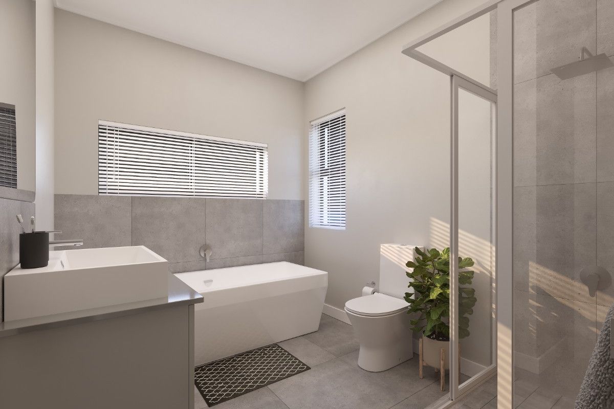Modern bathroom featuring a sleek freestanding bathtub, a spacious walk-in shower, contemporary vanity, and neutral grey floor-to-ceiling tiling.
