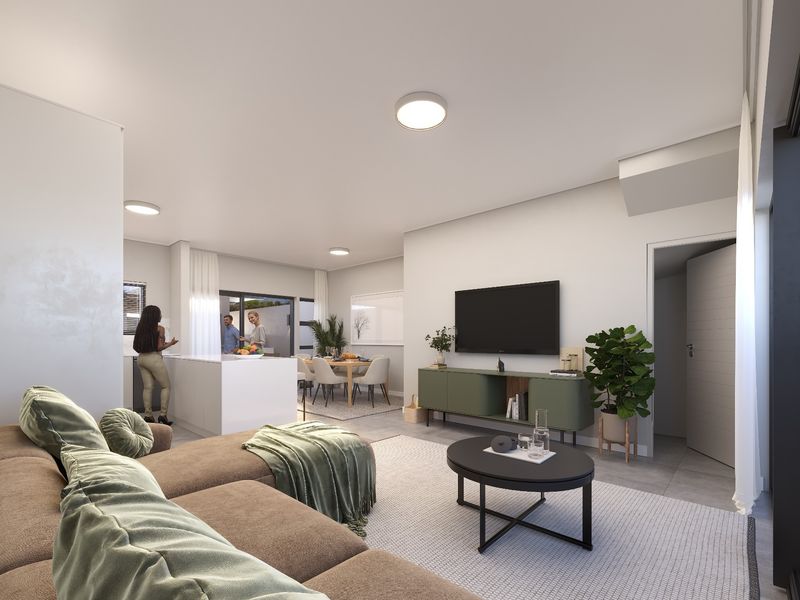 Modern open-plan living area featuring a sleek kitchen island, tiled flooring, and seamless flow to the dining space and outdoor access.