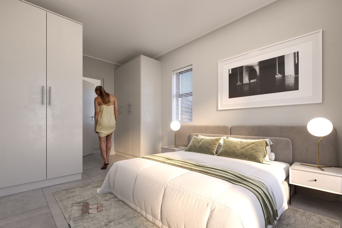 A modern, well-lit bedroom featuring neutral tones, built-in cupboards, and tiled flooring, creating a clean and contemporary living space.
