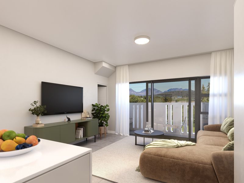 Modern living room featuring large sliding glass doors that open to a balcony with scenic mountain views and neutral tiled flooring.