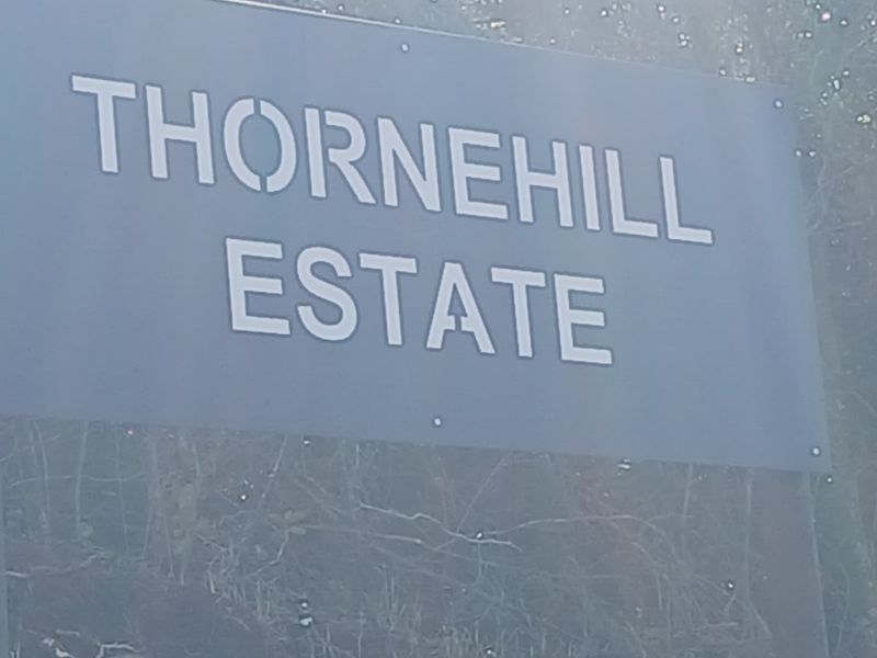 A sign indicating the entrance to Thornehill Estate.