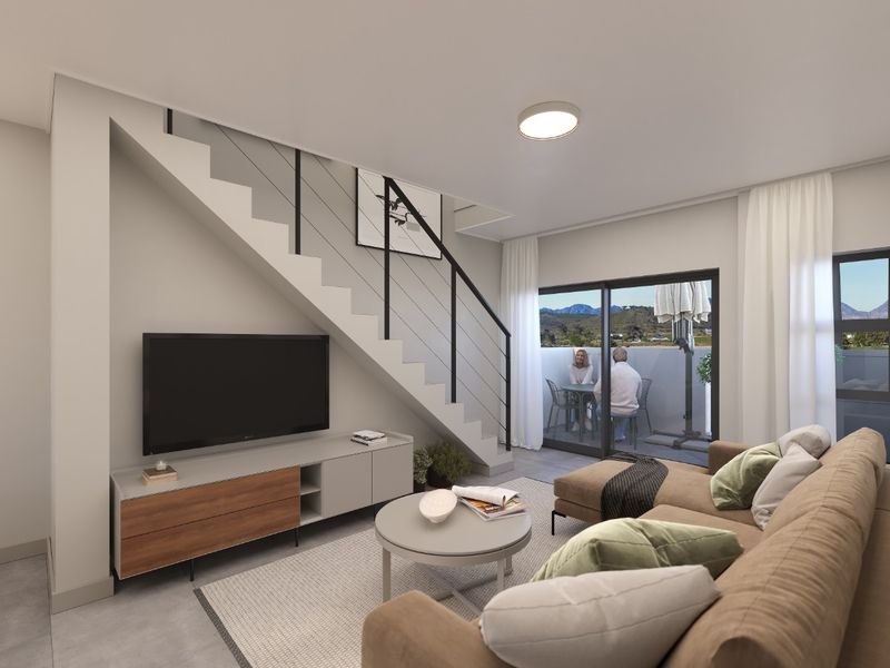 Modern living room featuring a sleek staircase with metal balustrade and large sliding glass doors leading to an outdoor patio area.