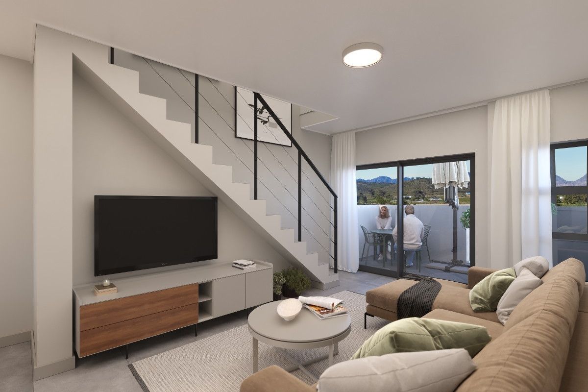 Modern living room featuring a sleek staircase with metal balustrade and large sliding glass doors leading to an outdoor patio area.