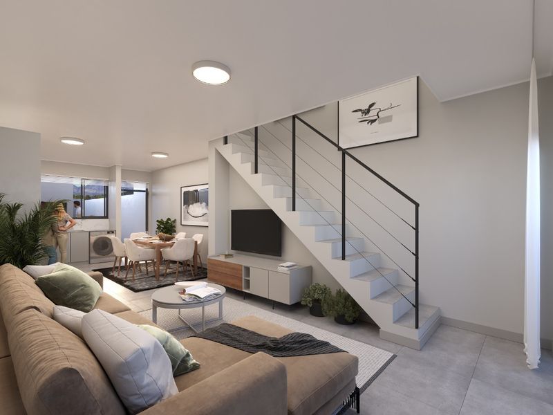 Modern open-plan living area featuring a sleek staircase with metal balustrade, neutral tiled flooring, and integrated lighting, creating a bright and cohesive space.