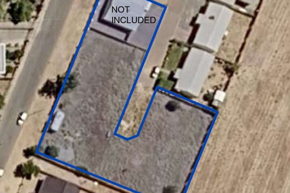Aerial view of the property plot showing the boundary lines and surrounding neighborhood layout.