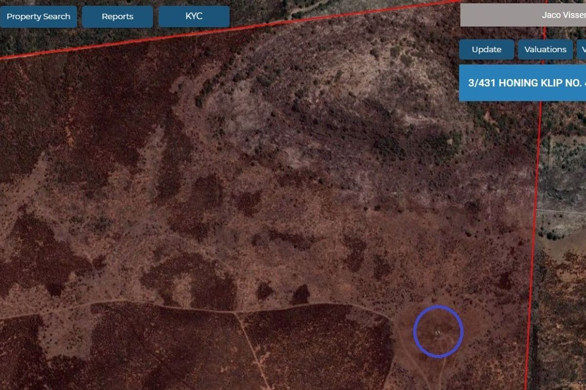 An aerial satellite view of a rural farm property showing natural landscape and terrain.