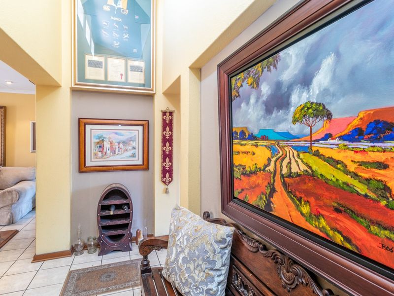 A well-maintained hallway featuring tiled flooring and architectural wall niches, providing a welcoming transition between living spaces.