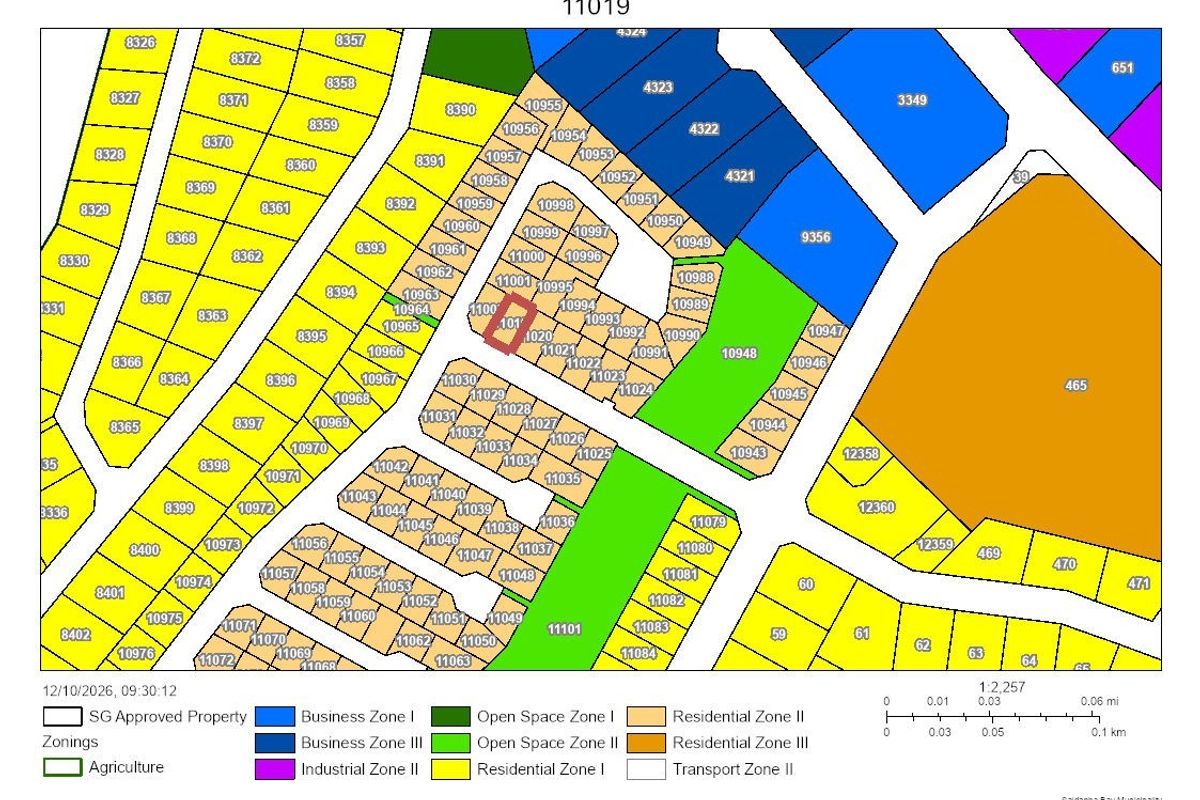 A detailed zoning map illustrating the layout and classification of residential and business plots within the area.
