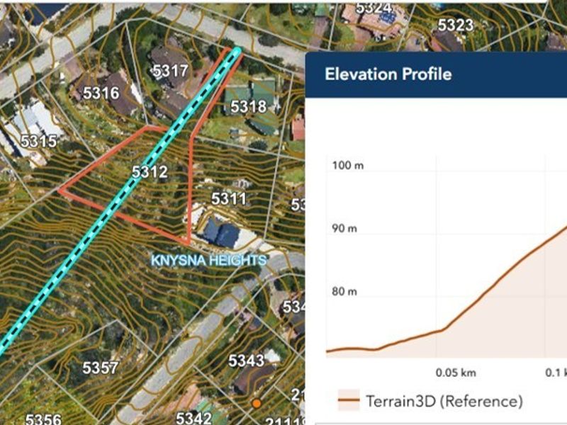Aerial view of the residential land plot showing topographical contour lines and an elevation profile indicating a significant slope across the property.