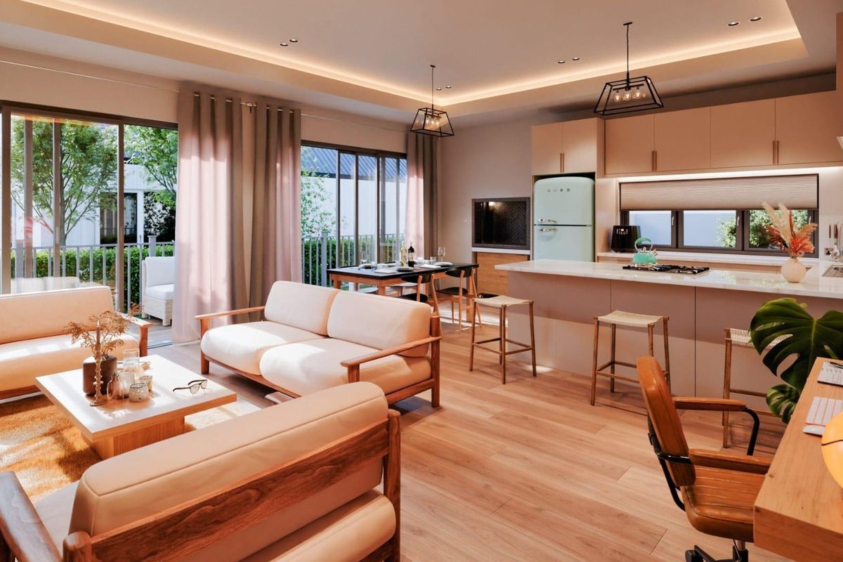 Modern open-plan living area featuring a sleek kitchen with island, laminate flooring, and large sliding doors leading to an outdoor patio space.