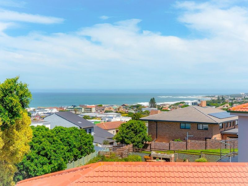 Elevated coastal view overlooking the surrounding residential neighborhood and ocean horizon.