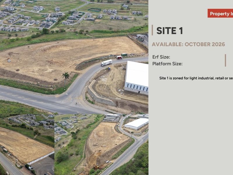 Aerial view of a large industrial development site featuring a cleared platform, existing warehouse structure, and established road access.