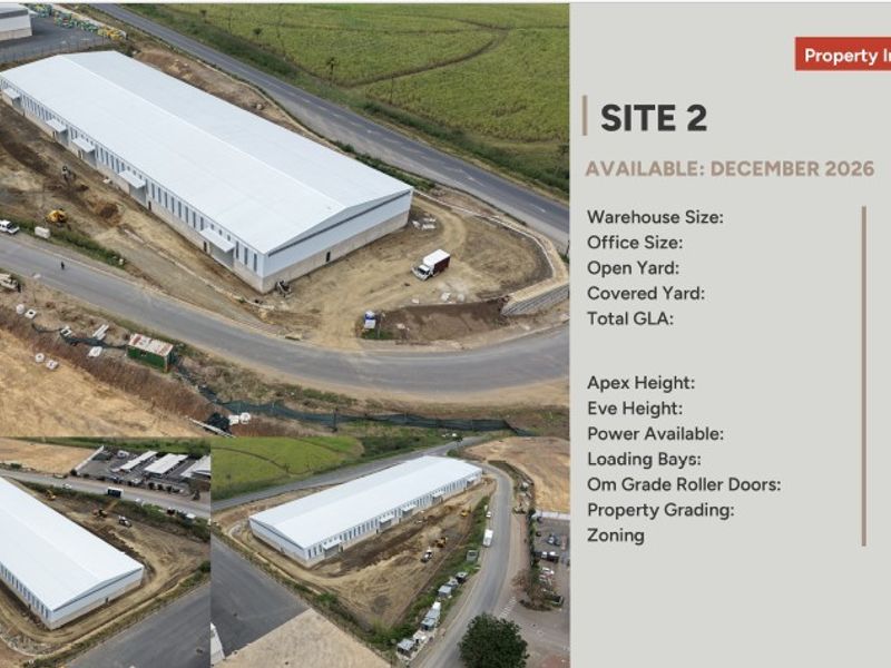 Aerial view of an industrial site featuring a large warehouse facility with roller shutter doors and extensive yard space.