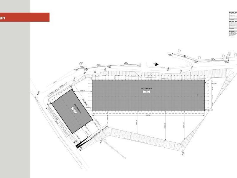 A detailed site plan illustrating the layout of industrial buildings and truck driveway access on the property.