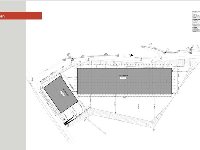 A detailed site plan showing the layout of the industrial property, including building footprints and truck driveway access.