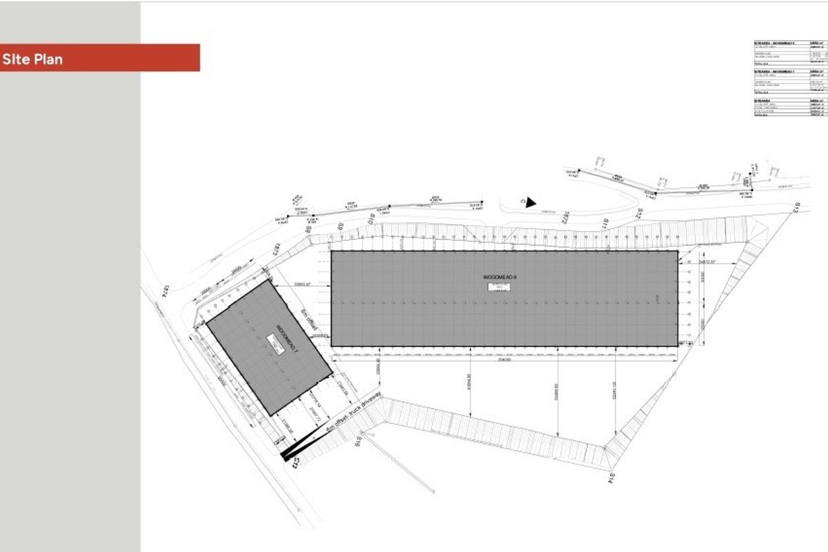 A detailed site plan showing the layout of the industrial property, including building footprints and truck driveway access.