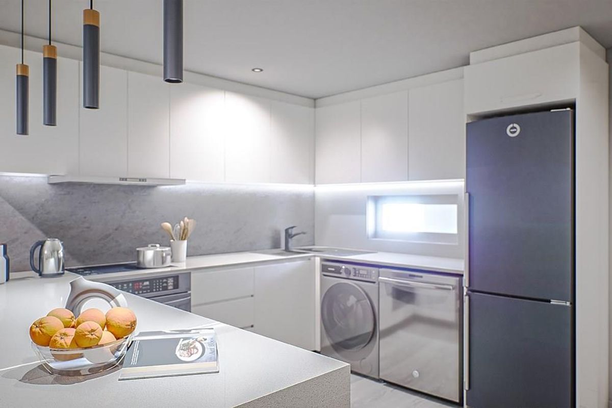 Modern kitchen featuring sleek white cabinetry, stone-look splashback, integrated lighting, and built-in stainless steel appliances including a washing machine and dishwasher.