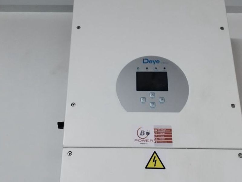 A wall-mounted Deye solar inverter unit installed for residential power management.