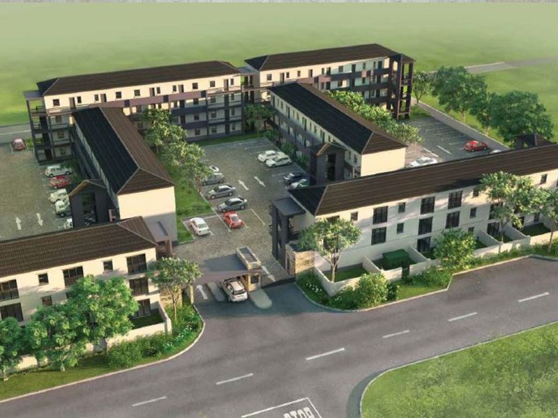 An aerial perspective of a modern apartment complex featuring multiple residential blocks, a central parking area, and a secure gated entrance.