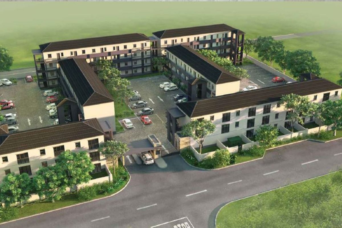 An aerial perspective of a modern apartment complex featuring multiple residential blocks, a central parking area, and a secure gated entrance.