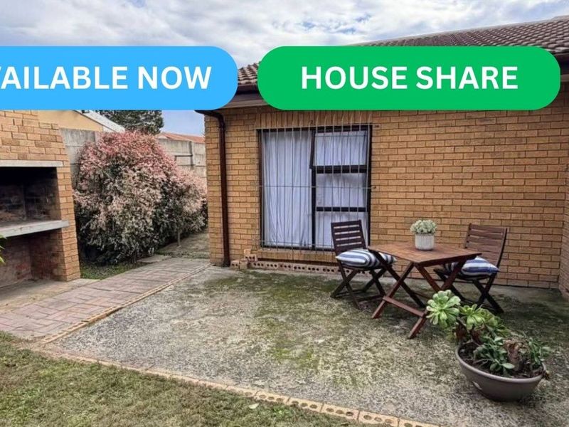 Rear exterior view featuring a paved patio area with a built-in brick braai and sliding door access to the house.