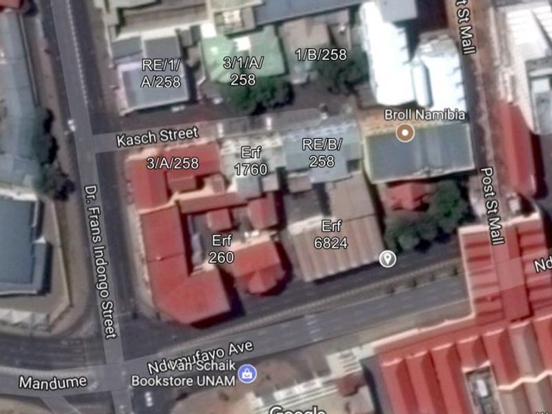 An aerial satellite view showing the urban layout and commercial building positioning near Kasch Street and Ndemufayo Avenue.