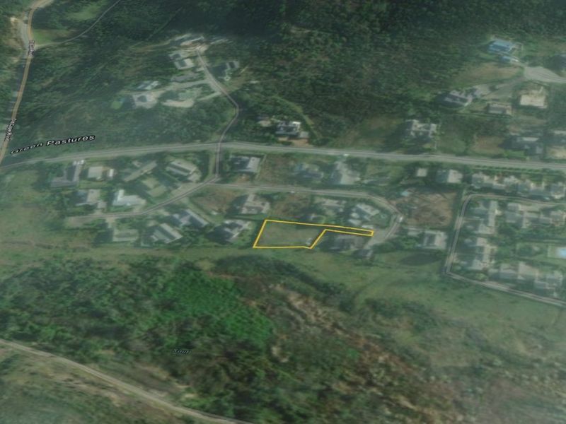 An aerial view showing the location and boundaries of the vacant residential land plot within the surrounding neighborhood.