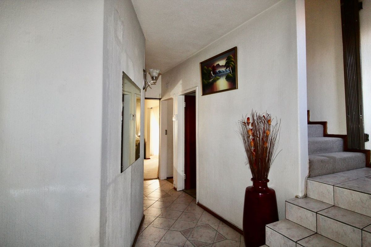 This 4-bedroom, 3-bathroom home in the sought-after, secure complex of Highway Gardens is designed for families who value both comfort and lifestyle:. - Photo 3