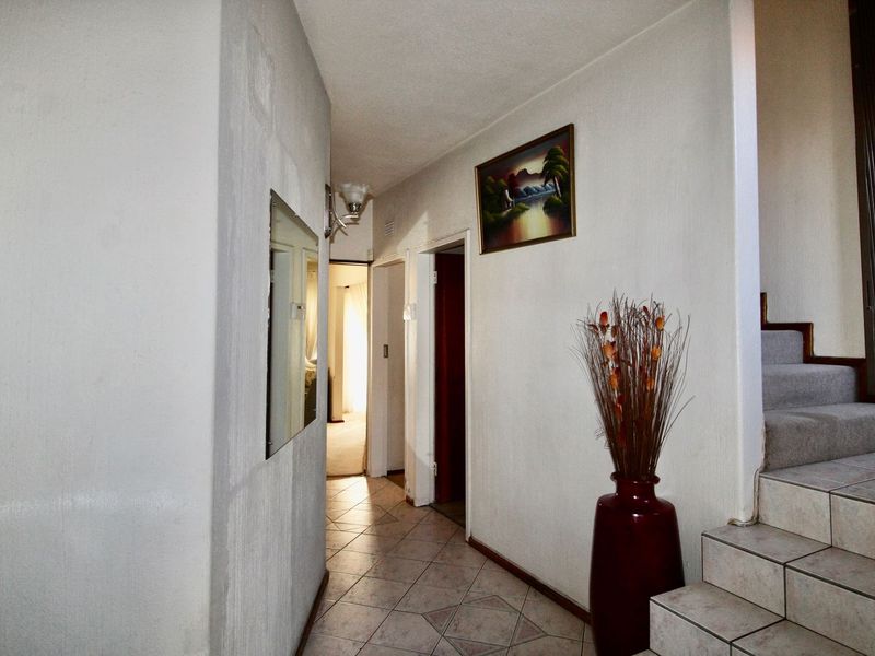 This 4-bedroom, 3-bathroom home in the sought-after, secure complex of Highway Gardens is designed for families who value both comfort and lifestyle:. - Photo 3