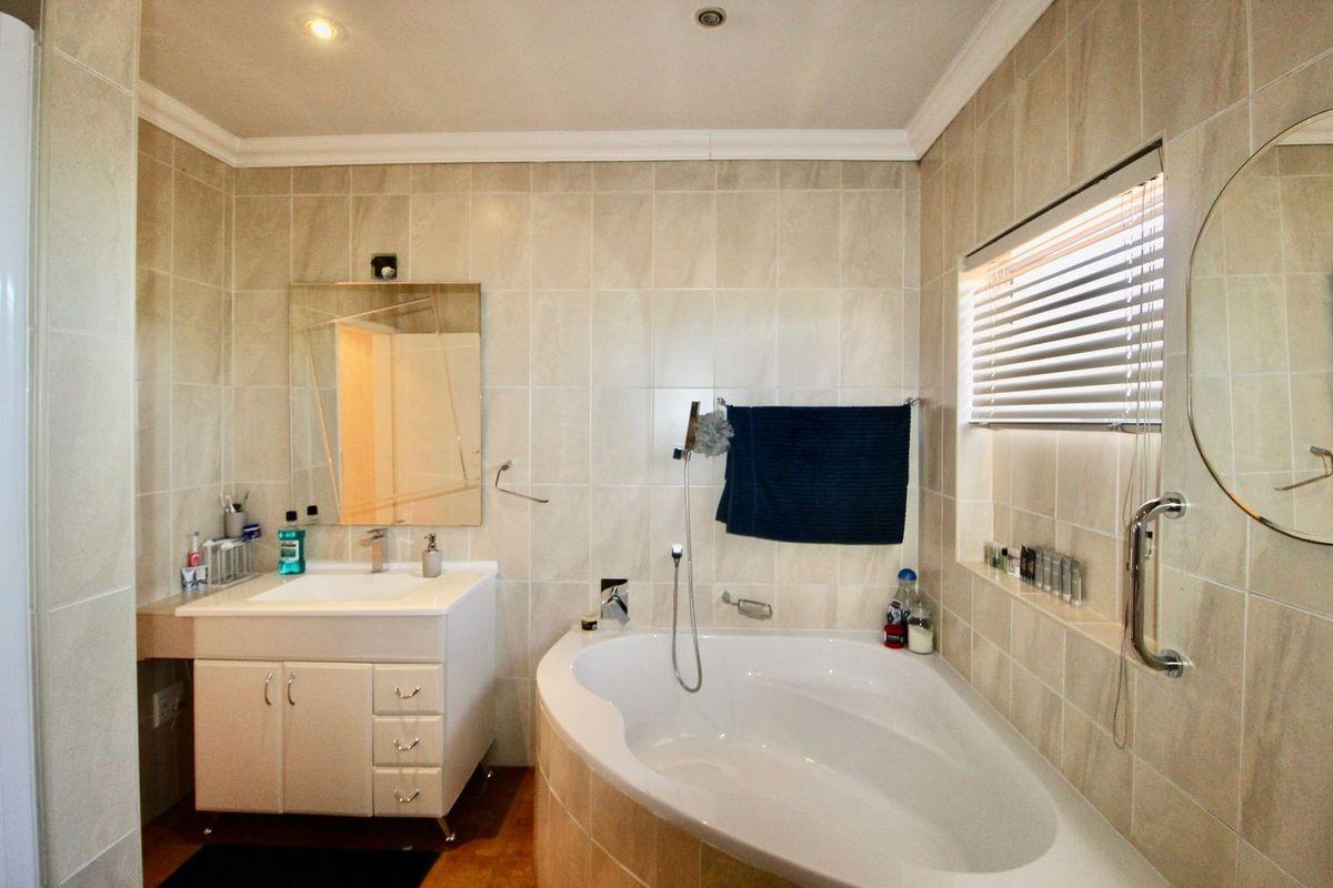 This 4-bedroom, 3-bathroom home in the sought-after, secure complex of Highway Gardens is designed for families who value both comfort and lifestyle:. - Photo 5