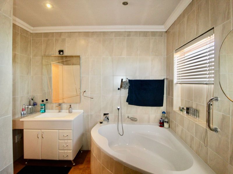 This 4-bedroom, 3-bathroom home in the sought-after, secure complex of Highway Gardens is designed for families who value both comfort and lifestyle:. - Photo 5