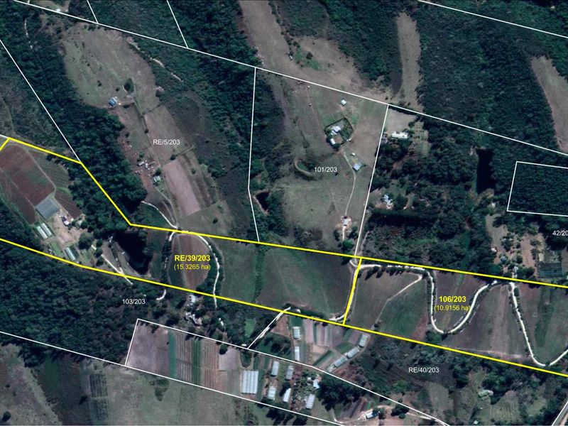An aerial view showing the layout and boundaries of the farm property, including access roads and surrounding landscape.
