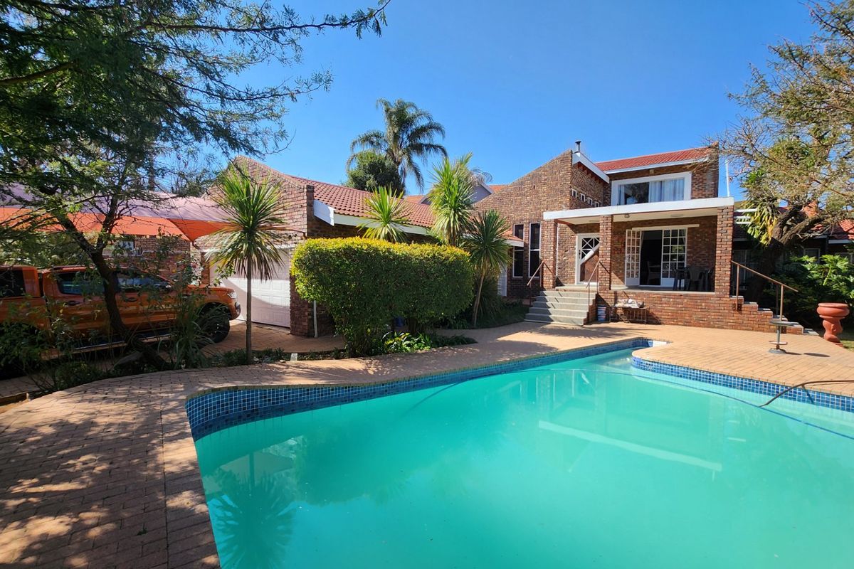 A Solid, Well-Loved Family Home with Space, Comfort, and a Pool for the Warmer Months - Photo 2