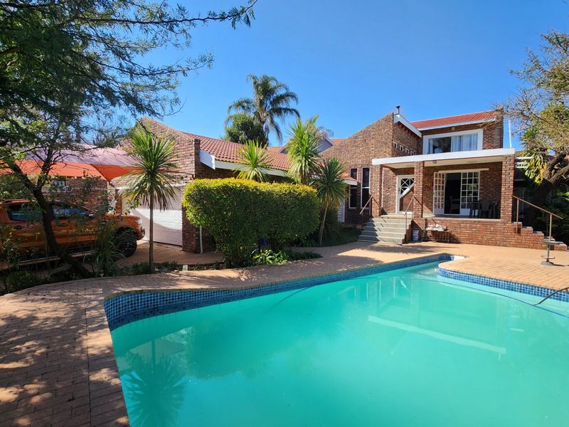 A Solid, Well-Loved Family Home with Space, Comfort, and a Pool for the Warmer Months - Photo 2