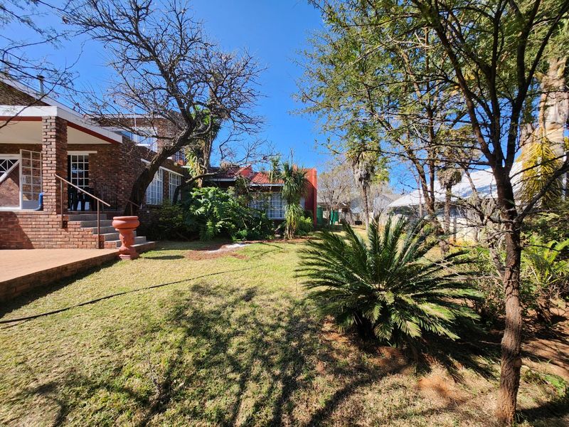 A Solid, Well-Loved Family Home with Space, Comfort, and a Pool for the Warmer Months - Photo 6