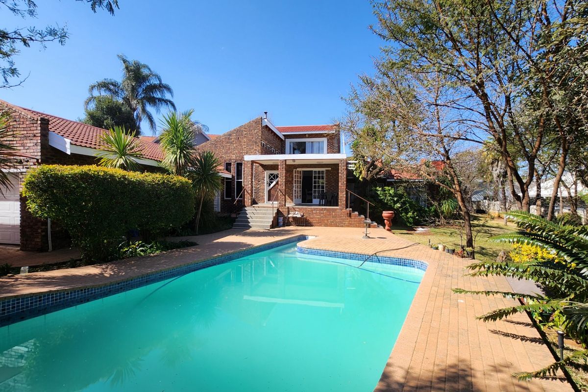 A Solid, Well-Loved Family Home with Space, Comfort, and a Pool for the Warmer Months - Photo 3