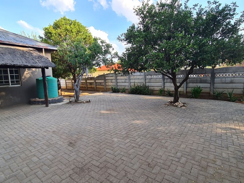 Strategically situated on the corner of a busy street, this residence has lots of additional space on the stand for development. - Photo 3