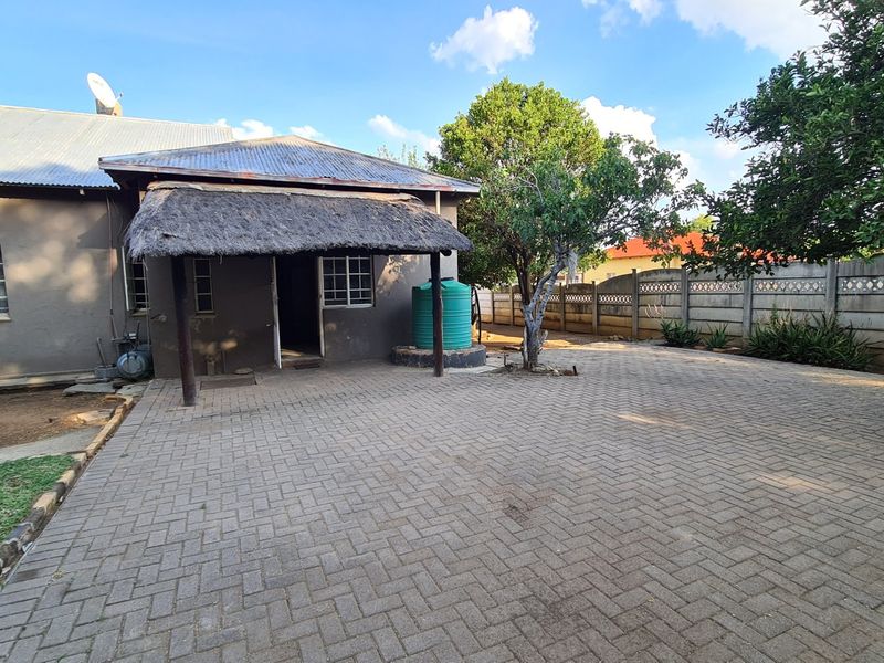 Strategically situated on the corner of a busy street, this residence has lots of additional space on the stand for development. - Photo 4