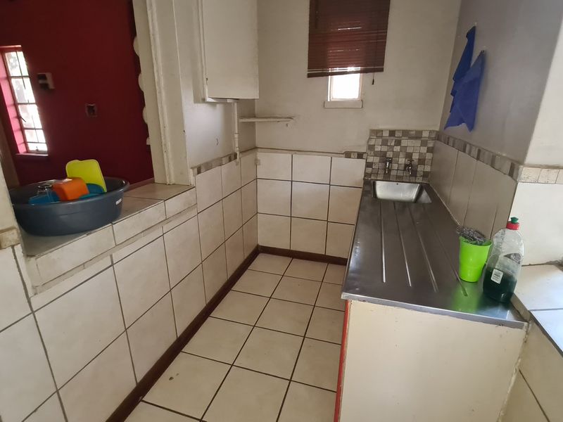 Strategically situated on the corner of a busy street, this residence has lots of additional space on the stand for development. - Photo 7