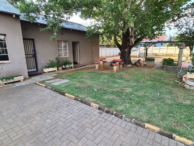 Strategically situated on the corner of a busy street, this residence has lots of additional space on the stand for development. - Photo 2