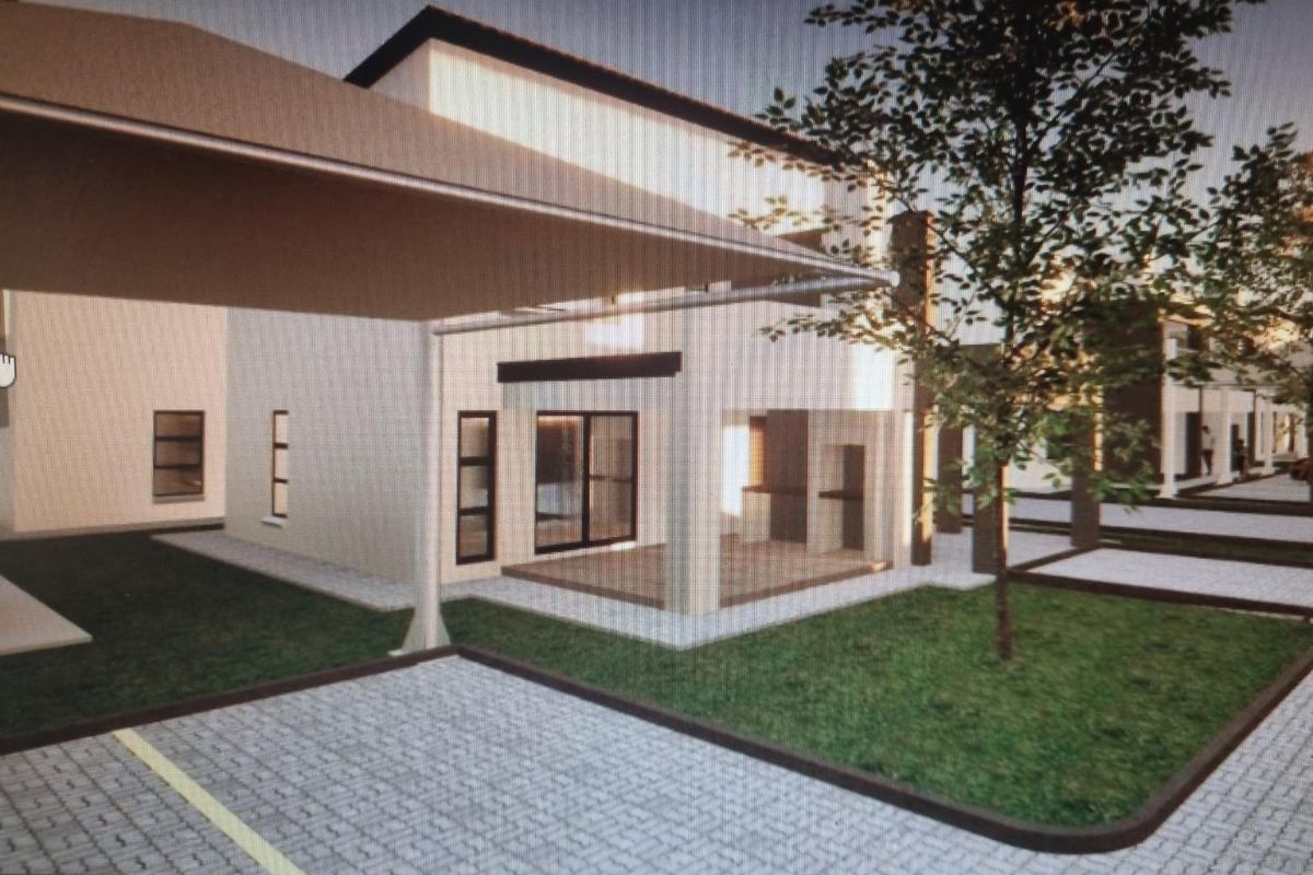 A modern residential exterior featuring a paved driveway, covered carport, and landscaped garden area with contemporary architectural design.
